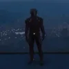 GTA V RP futuristic armored character standing over a city at night.