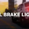 FiveM vehicle with active brake lights during sunset on a city road.