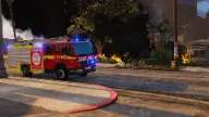 Fire truck responding to fire in ESX firefighting script for FiveM roleplay