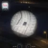 FiveM screenshot of ESX Helicopter Camera Script showing a police helicopter spotlight tracking a vehicle at night.