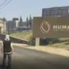 FiveM screenshot showing a player outside Humane Labs using the ESX Humane Labs Security Script for high-security facility roleplay.