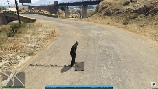 Screenshot of a player deploying spike strips on a rural road using the ESX Spikestrips Script in FiveM.