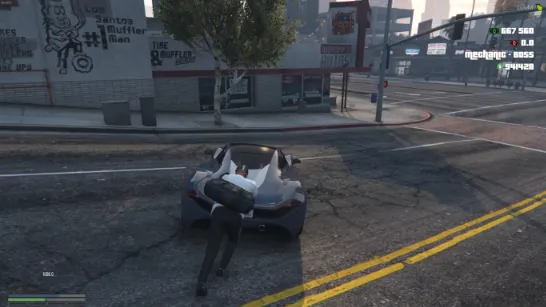 Player pushing a disabled sports car using the ESX Vehicle Push Script on a city street in FiveM.