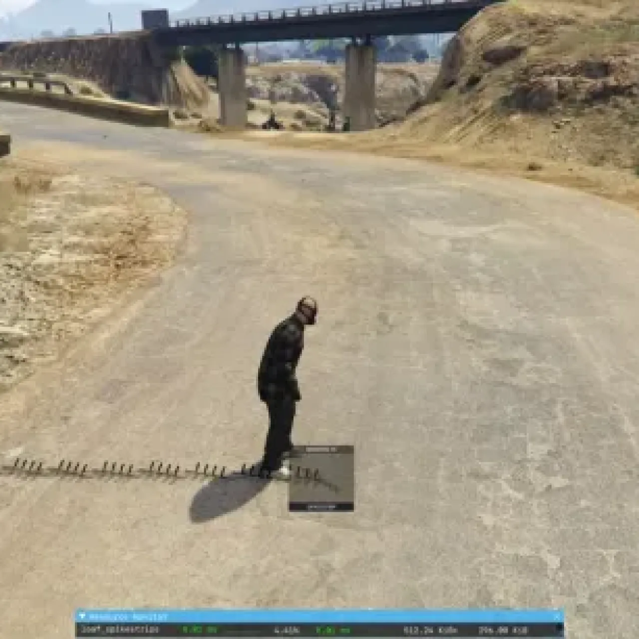 Screenshot of a player deploying spike strips on a rural road using the ESX Spikestrips Script in FiveM.